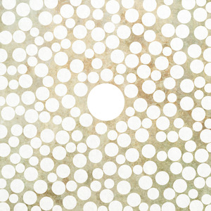 A larger white circle at center, surrounded by lots of smaller off-white circles.